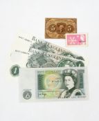 Three £1 notes and a US five cents note