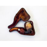 Meerschaum and amber pipe in the form of lady's hand with cuff holding fly beneath the metal