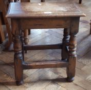 Reproduction oak joint stool with moulded edge top, on turned legs,
