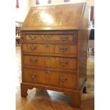 Lady's walnutwood bureau with fitted interior and four graduating long drawers