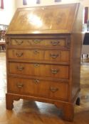 Lady's walnutwood bureau with fitted interior and four graduating long drawers