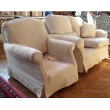 Two-seater sofa with loose cushions and matching armchair with beige upholstery