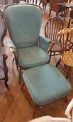 Contemporary comb back armchair with loose cushion seat,
