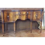 Serpentine fronted sideboard with one frieze drawer and two flanking cupboards,