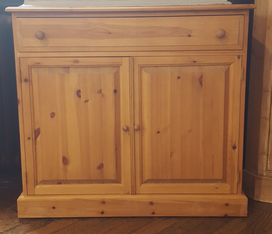 Pine cabinet with one long drawer and cupboard to bottom,