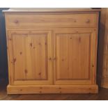 Pine cabinet with one long drawer and cupboard to bottom,