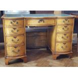 Georgian style walnut kneehole desk with inset leather writing surface, frieze drawer,