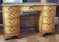 Georgian style walnut kneehole desk with inset leather writing surface, frieze drawer,