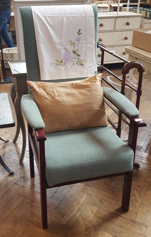 Armchair with green weave cushions