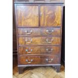 Stained wood cabinet with four graduating drawers,