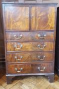 Stained wood cabinet with four graduating drawers,