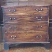 Stained oak chest of drawers with four graduating drawers, cockbead border, swan neck handles,