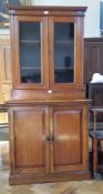 Victorian walnut glazed bookcase with pair of panelled doors enclosing adjustable shelves,