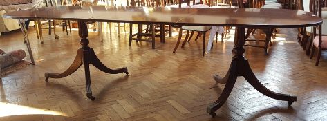 George III style mahogany D-end extending double pedestal dining table on reeded swept supports