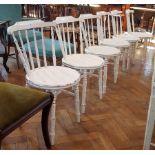 Set of six white painted stickback chairs with circular solid seats,