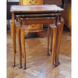 Nest of three burrwood occasional tables on cabriole legs with pad feet,