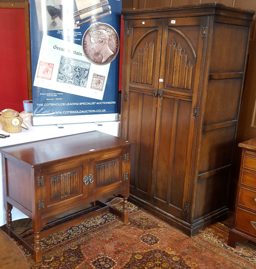 Oak wardrobe with linenfold pattern and oak side table with linenfold pattern,