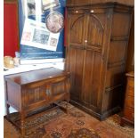 Oak wardrobe with linenfold pattern and oak side table with linenfold pattern,