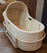 Lloyd Loom style wicker cradle with removable legs