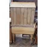 Pine storage hut with hinged sloping top together with 19th century drop-flap table on turned legs