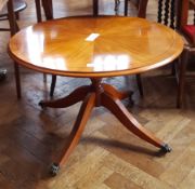Reproduction circular-top coffee table on pedestal support with splayed legs,