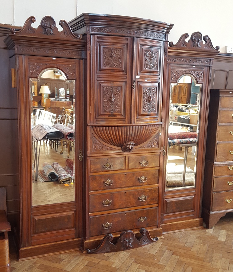 19th century carved walnut breakfront wardrobe with floral scroll engraving