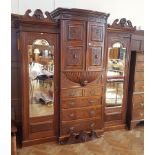 19th century carved walnut breakfront wardrobe with floral scroll engraving