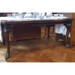 Stained oak table on cabriole supports,