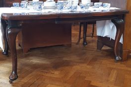 Stained oak table on cabriole supports,