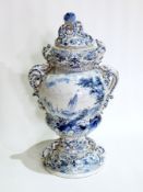 19th century Dutch delft covered vase, the cover with fruit and scroll surmount,