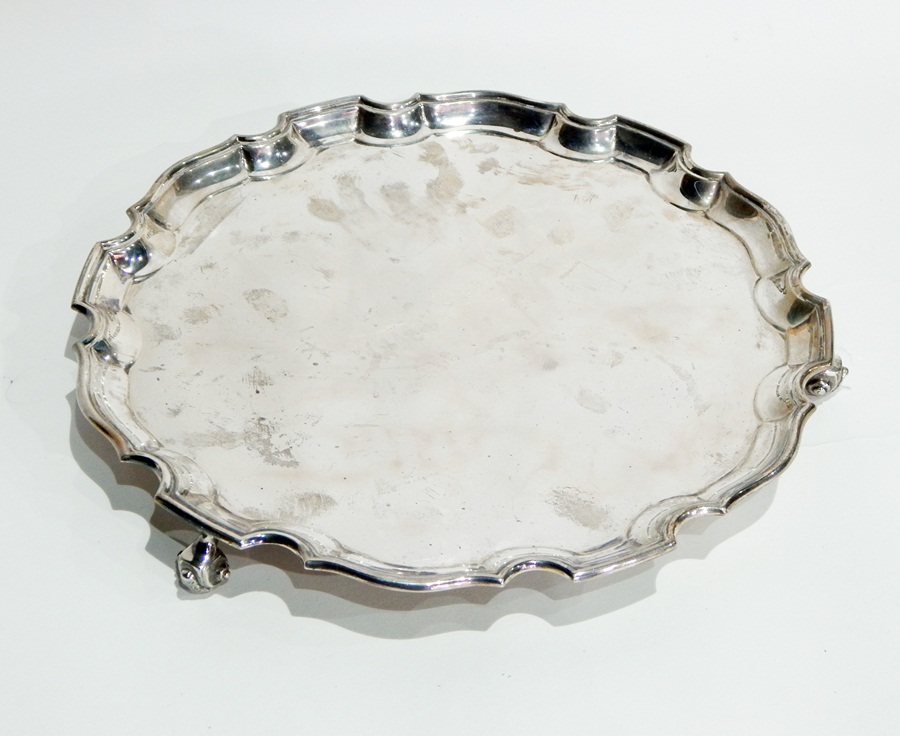 Silver salver with pie-crust border, raised on scroll feet, London 1961, diameter 30cm, 26oz approx.
