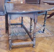 Antique oak gateleg table on tapered and bulbous supports,