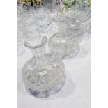 Two cut glass decanters with bulbous bases, cake stand,