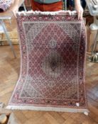 Tabriz rug, pink ground with central cream medallion,