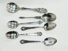 Seven Norwegian silver spoons, various to include serving spoon, dessert spoons, etc.