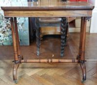 Victorian rosewood rectangular top side table raised on twin column supports,