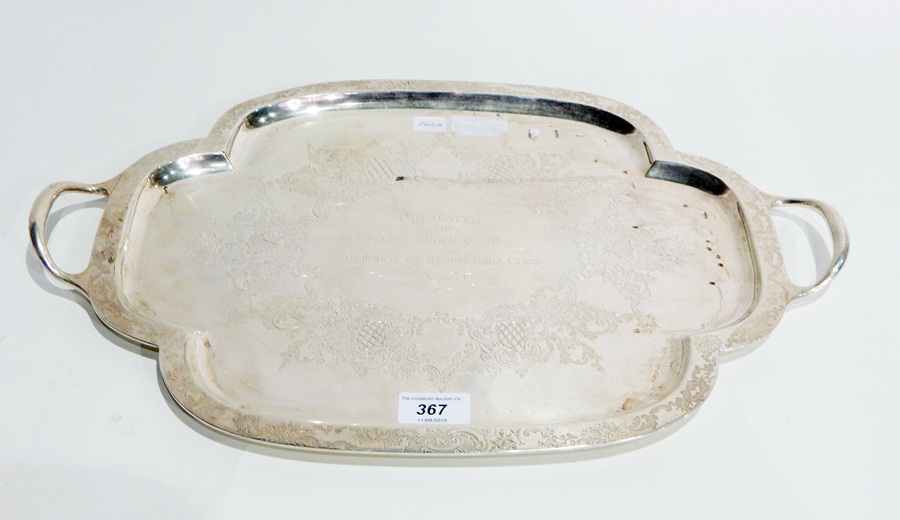 A silver two-handled tray with chased decoration and bearing presentation inscription London 1895,