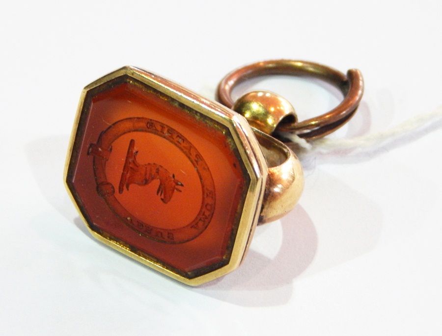 Large 19th century gold-coloured metal seal set with shaped rectangular carved cornelian,