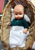 Sebino Italian vinyl baby boy doll in wicker cradle