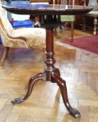 A Georgian mahogany circular top tripod table with birdcage movement,