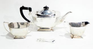 Silver three-piece teaset, rounded rectangular, Sheffield 1940 and pair sugar nips,