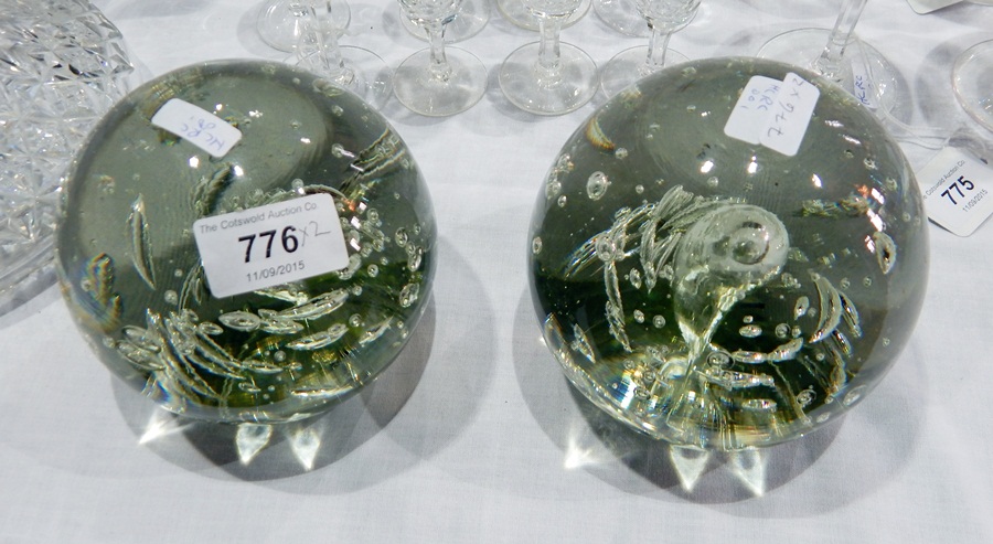 Two bubble glass paperweights