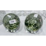 Two bubble glass paperweights