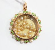 Victorian gold, enamel and pearl glass locket pendant, circular with green,