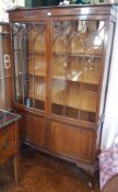 Chippendale style mahogany astragal glazed bookcase with pair doors enclosing shelves,