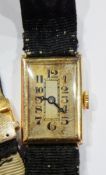 Vintage lady's gold wristwatch, rectangular on black,