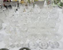 Large collection of cut glass to include wine goblets with floral engraving, brandy balloons,