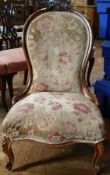 Victorian carved walnut frame spoon-back chair with floral upholstery,