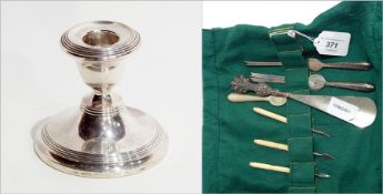 Silver dwarf candlestick on circular foot together with lobster picks, nut picks, shoe horn, etc.