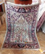 Silk rug decorated with flowering tree, floral and animal border,